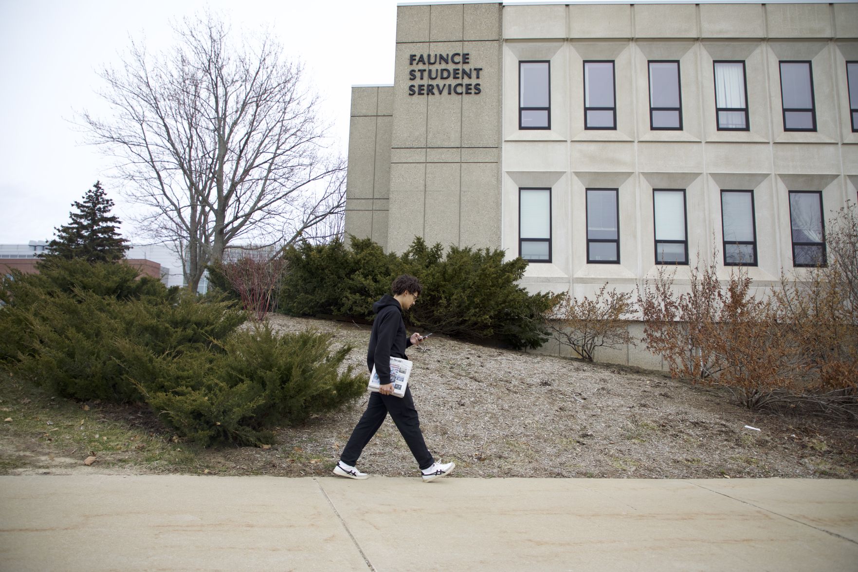 Samuel J. Robinson walks out of Faunce Student Services
